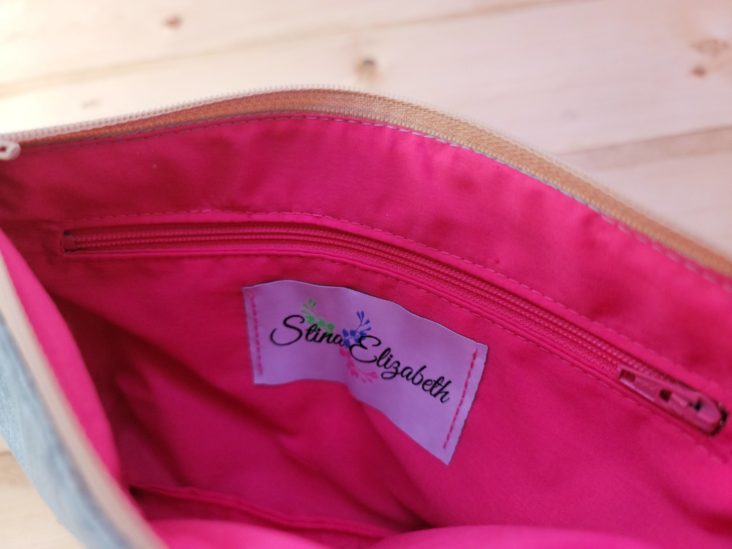 inside grayish blue handbag clutch
