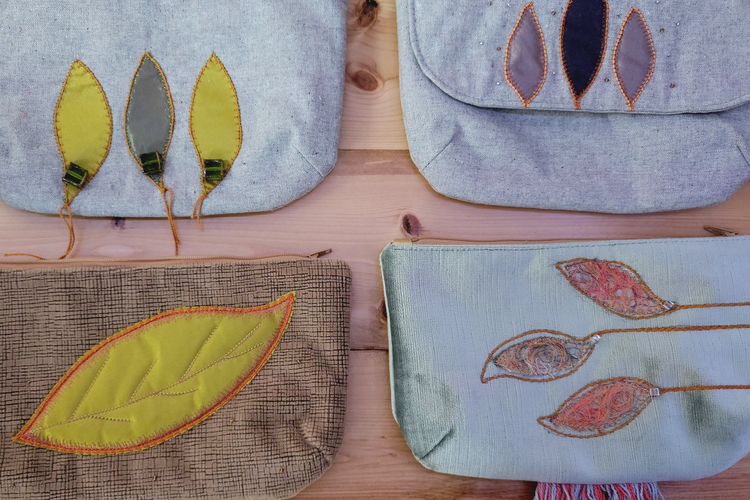 Handbags in gray tones and blush, with leaves applique on top