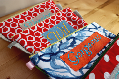 Zipper pouches in colors red, white and blue.  Embroidery in the front.