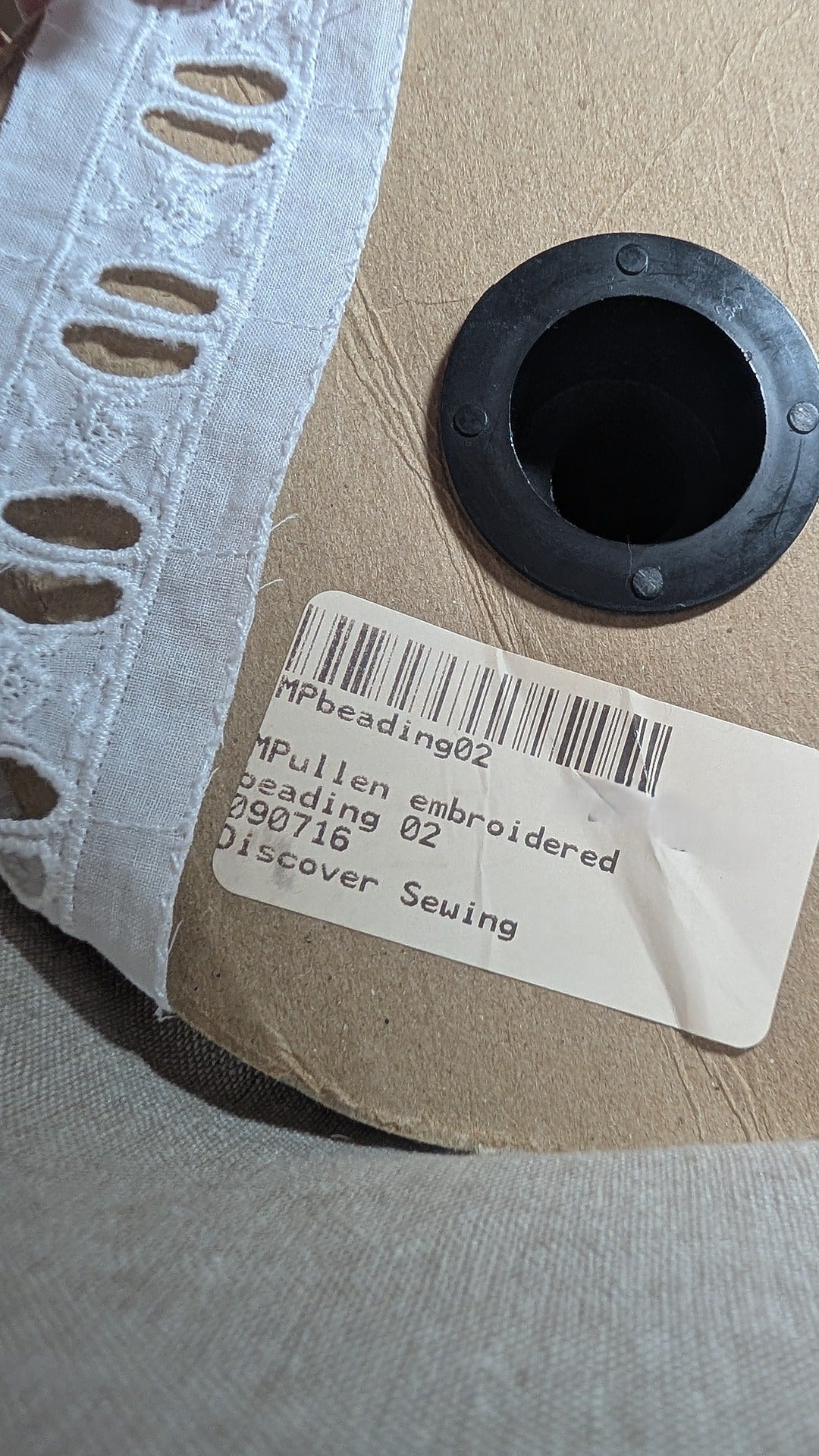 Close-up Martha Pullen Swiss Beading Trim flower motif and product label