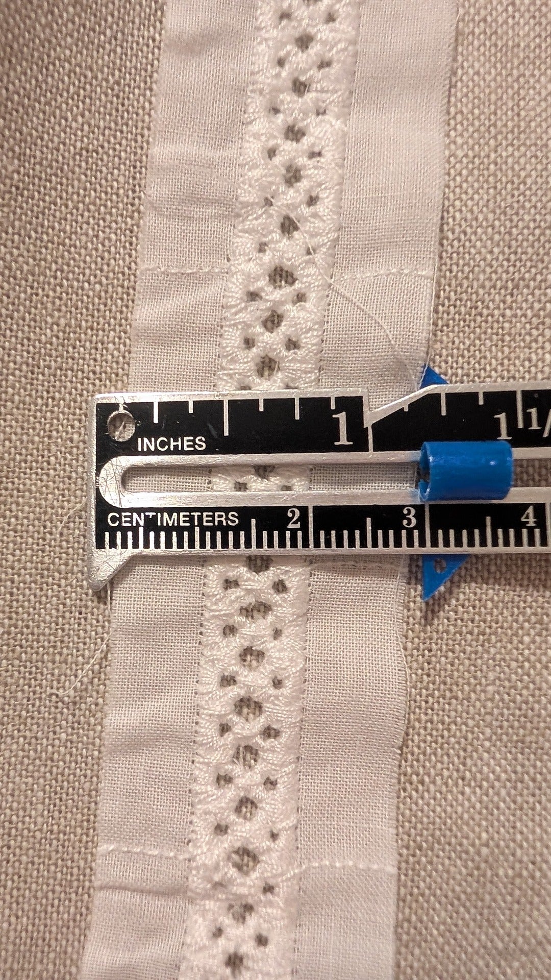 Close-up Swiss Cotton embroidery trim from Martha Pullen in white and measuring gauge