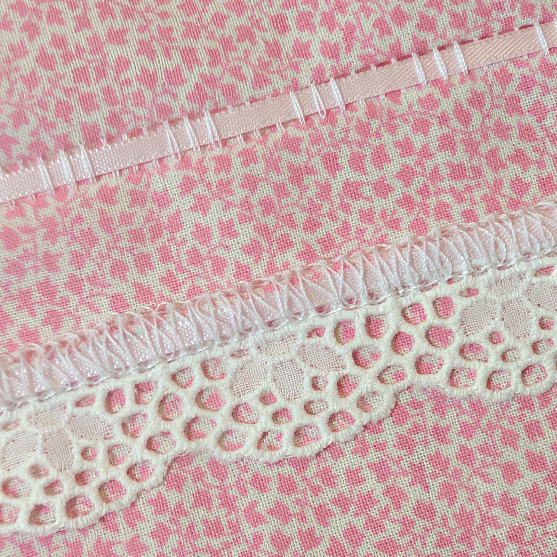 Detail of flatlock serger stitch with tatting trim and ribbon