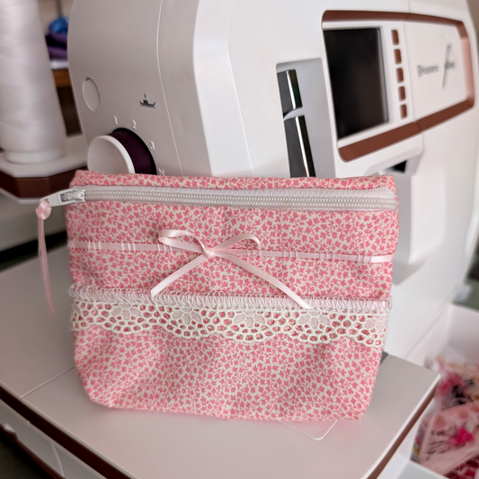 Pink pouch with tatting trim and pink lace.