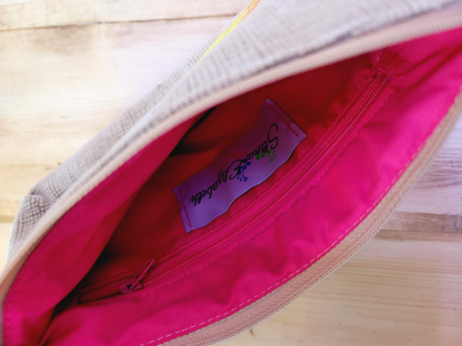 Inside of blush pink and green leaf applique handbag clutch