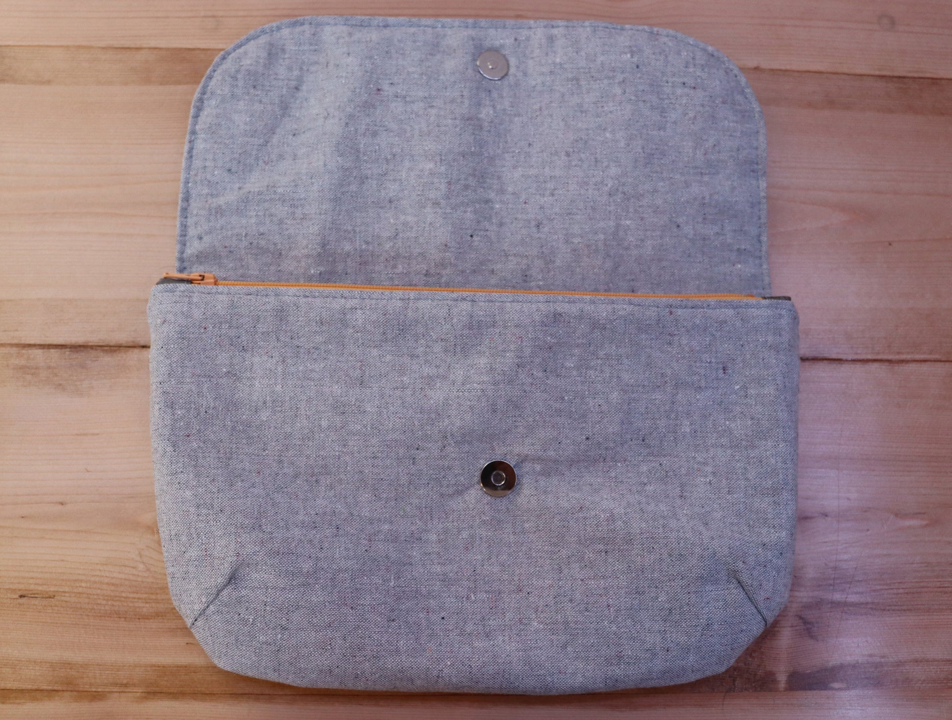Open gray handbag clutch with flap 